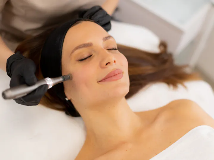 Dermatologist examining a patient's skin at Prism Dubai